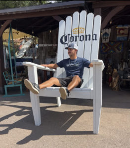 Oversized white stained adirondack chair with Corona MB decal